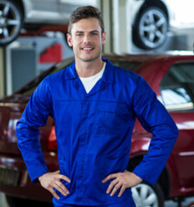 Mechanic Standing With Hands Hip Repair Shop
